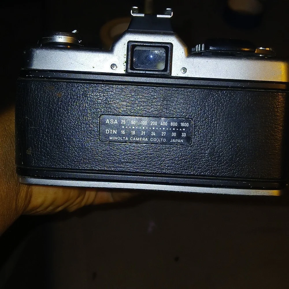 vintage Minolta SR-T series 35mm SLR film camera with a z